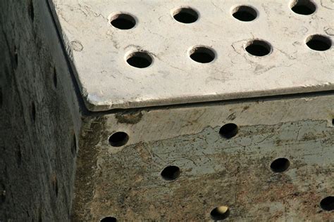 Close-up of textured metal surface with round holes Free Stock Photo ...