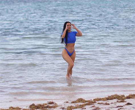 Kim Kardashian Shows Off Her Sensational Curves In A Blue Bikini During