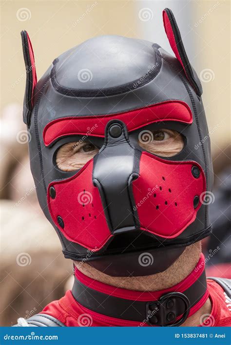 A Man Displaying His Fetish Red And Black Puppy Mask Attending The Gay Pride Parade Also Known