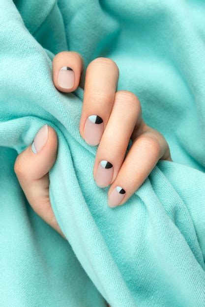 Premium Photo Woman S Hands With Nude And Blue Matte Nail Design