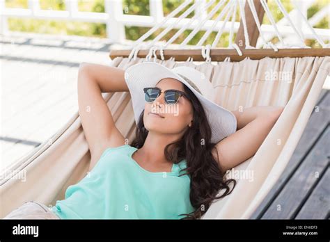 Pretty Brunette Relaxing On A Hammock Stock Photo Alamy