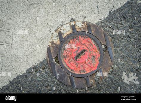 Water Supply Valve Cover In A French Street Stock Photo Alamy