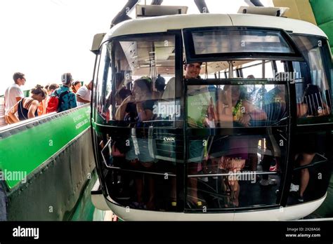Touristsvisitors In The Cable Car Teleferico On Their Way To