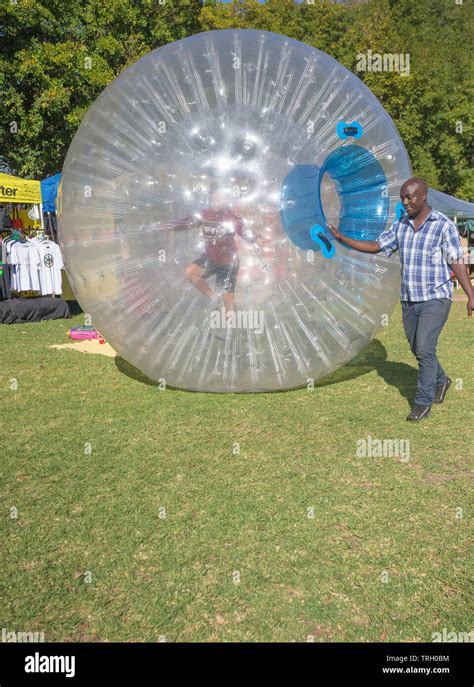 Man inside zorbing ball hi-res stock photography and images - Alamy