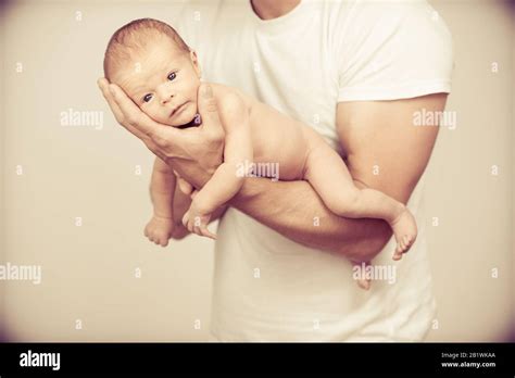 Father Holding New Born Baby On His Arm Stock Photo Alamy