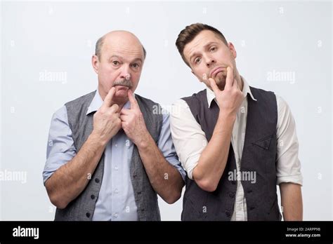 Two Mature Men Father And Son Being Sad And Tired Negative Facial Emotion Stock Photo Alamy