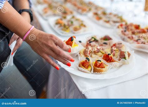 Close Up Of Female Hand Holding Canape Buffet Meal Event Concept Stock