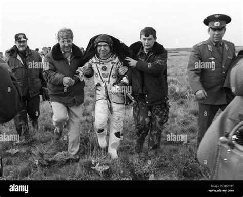 Cosmonaut Sergei Krikalev center after the Soyuz TM 7 landing Stock ...