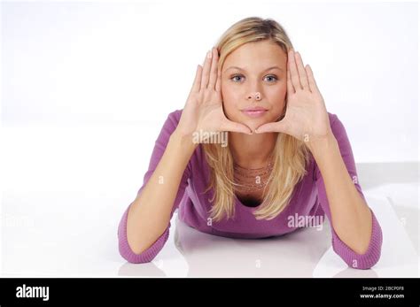 Atractive Blonde Woman In Violet Sweater Stock Photo Alamy