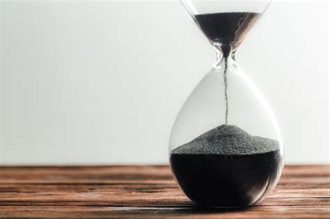 Premium Photo Modern Hourglass On Wooden Surface