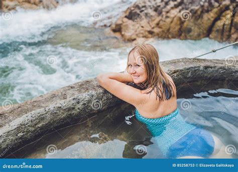 Geothermal Spa Woman Relaxing In Hot Spring Pool Against The Background Of A Waterfall Stock