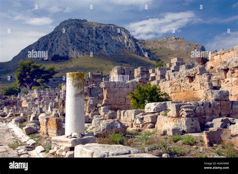 Ruins of the ancient city of Corinth with the Acropolis of Acrocorinth ...