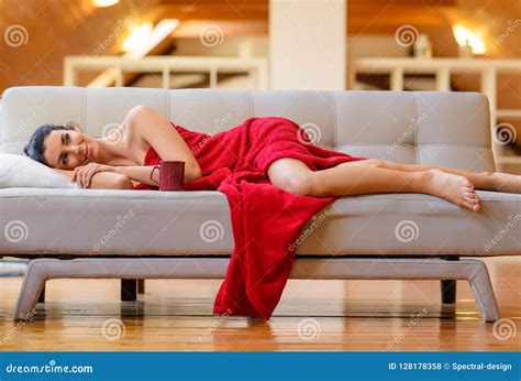A Beautiful Nude Woman Wrapped In A Cozy Blanket Relaxing On The Stock Photo Image Of Nude