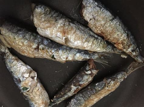 Some Fish Are Sitting In A Pan On Top Of The Stove And Ready To Be Cooked