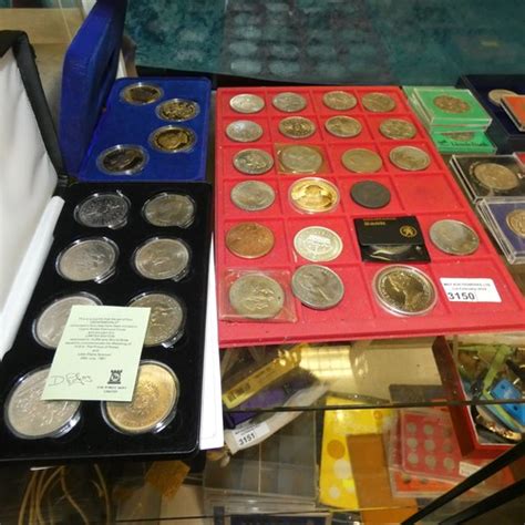 A Quantity Of Miscellaneous Boxed Collectors Coins One Shelf