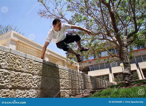 Young Man Jumping Over A Fence Stock Image Image Of Park Summer