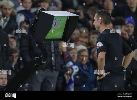 Referee David Coote goes over to the VAR screen during the Premier ...