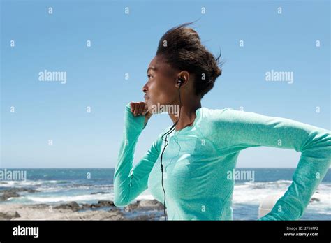 Side Portrait Of Active Young Woman Running Outside Stock Photo Alamy