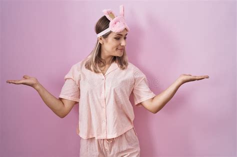 Blonde Caucasian Woman Wearing Sleep Mask And Pajama Smiling Showing