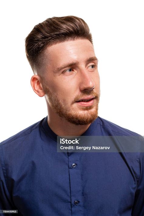 Attractive Young Man Wearing Blue Shirt Isolated Over A White