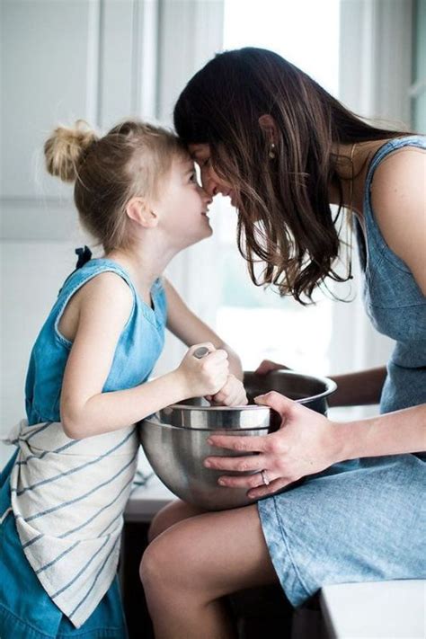 A Lovely Intimate Moment Of Mom And Daughter Cooking Together In The