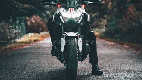 Closeup Shot Of A Person On A Kawasaki Z900 Naked Motorbike In The Forest Editorial Image