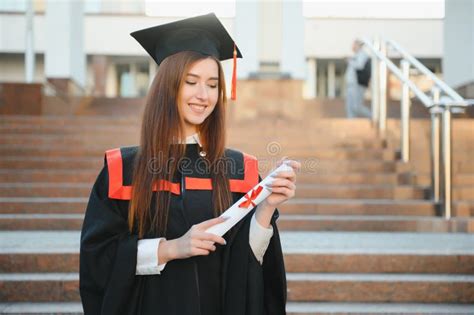 Happy Cute Brunette Caucasian Grad Girl Is Smiling She Is In A Black