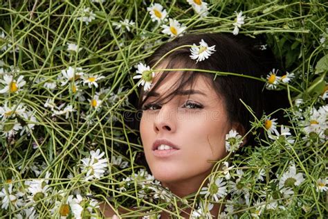 Beautiful Sensual Brunette Woman Lying On A Grass Outdoor Beautiful Pretty Girl Outdoors