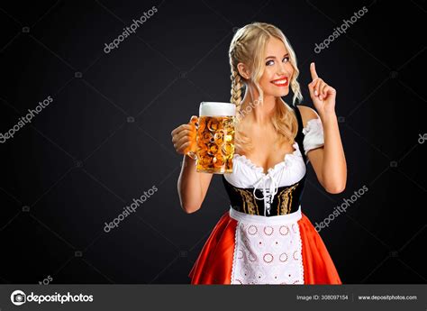 Smiling Young Sexy Oktoberfest Girl Waitress Wearing A Traditional