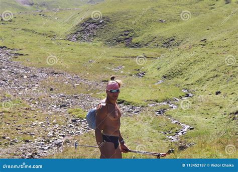 Athletic Naked Man Tourist Stands Half Turned And Looks Into The Stock Image Image Of Nature