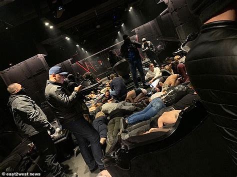 Lingerie Clad Women Lie On The Floor As Police Carry Out Raid On Illegal Russian BDSM Sex Club