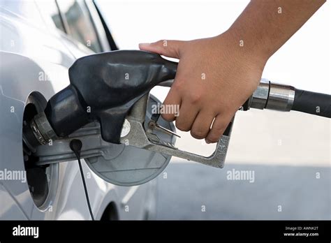 A Person Filling A Petrol Tank Stock Photo Alamy