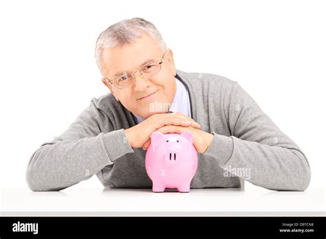 Satisfied Mature Gentleman Posing Over A Piggy Bank Stock Photo Alamy