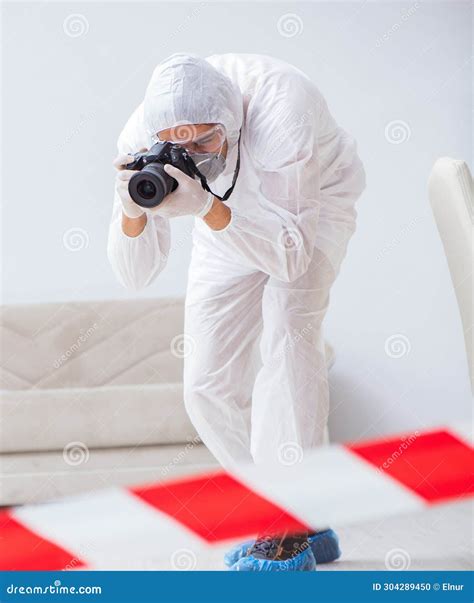 Forensic Expert at Crime Scene Doing Investigation Stock Photo - Image