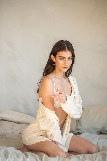 Premium Photo Sexy Brunette In Lingerie And Bra Posing In Studio