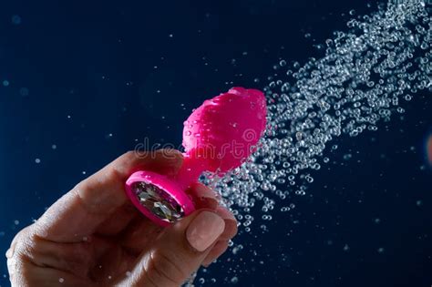 Woman Washing Pink Anal Plug Under Shower On Blue Background Stock Photo Image Of Jewellery