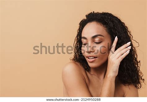 Shirtless Black Woman Posing Holding Her Stock Photo