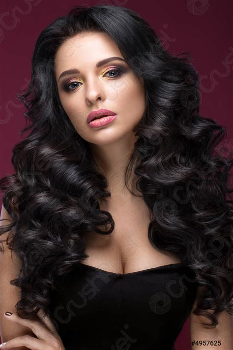 Beautiful Brunette Model Curls Classic Makeup Gold Jewelry And Red Stock Photo