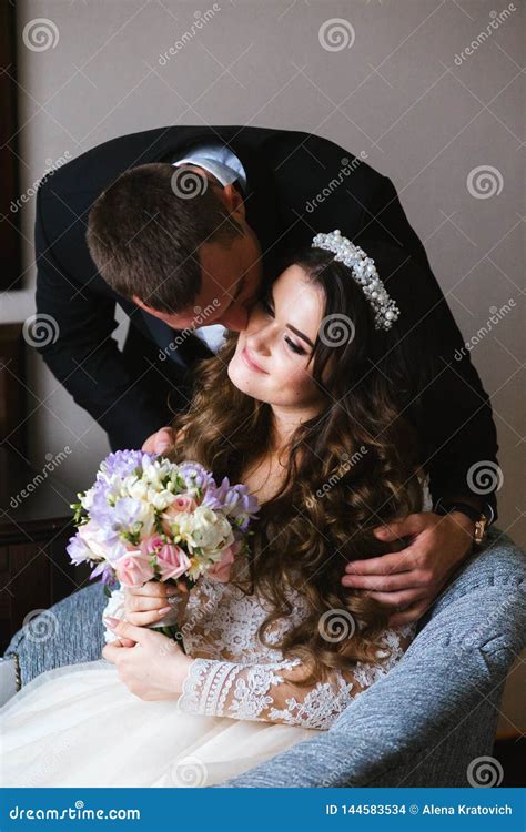 Beautiful Wedding Couple Together Bride And Groom Kiss And Hug Each