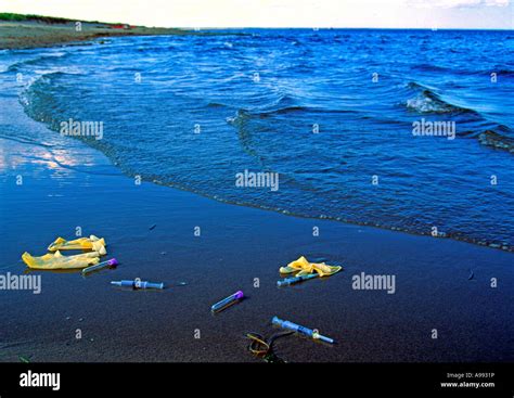 medical waste washed up on a beach Stock Photo - Alamy