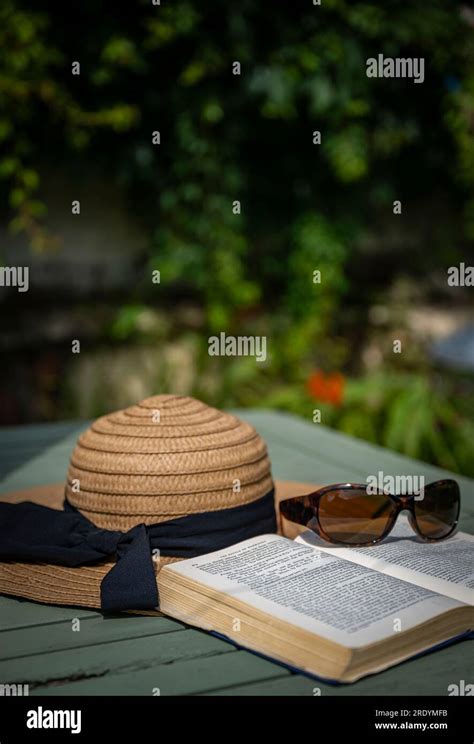 Summer Iconic Scene Of A Hot Lazy Summers Day A Sun Hat Book A