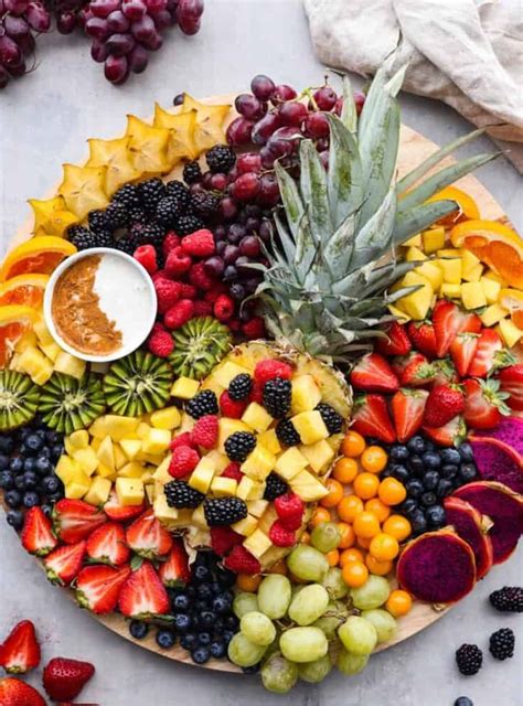 A Platter Filled With Fruit Berries Pineapples And Other Fruits