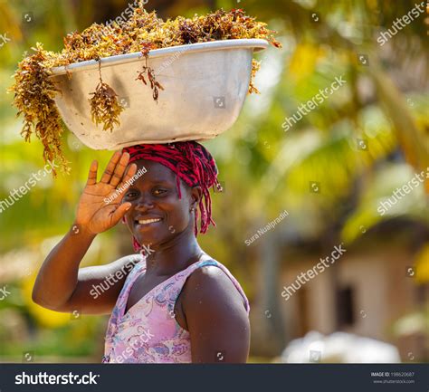 African Woman Carrying Basket On Head