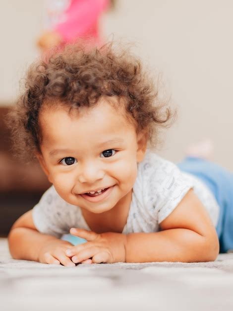 Premium Photo Portrait Of Cute Mixed Race Baby Boy With Curly Hair