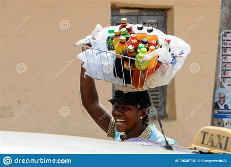 Unidentified Ghanaian Woman Carries A Basket On Her Head At The