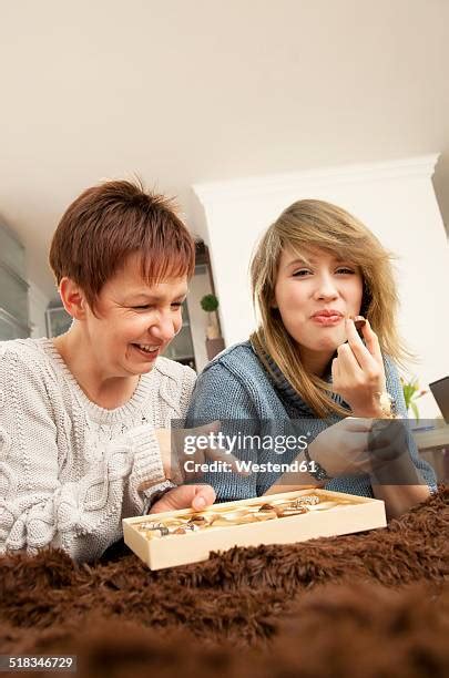 Mother Daughter Eating Chocolate Photos And Premium High Res Pictures