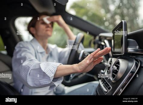 Woman Drives Car With Broken Air Conditioner In Hot Weather Wipes Sweat On Face Stock Photo Alamy