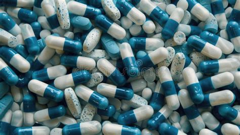 Close Up Pile Of Blue White Antibiotic Capsule Stock Illustration