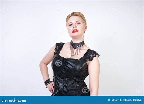 Cryel Beautiful Bdsm Mistress With Short Blonde Hair Wearing Black Leather Dress And Fetish