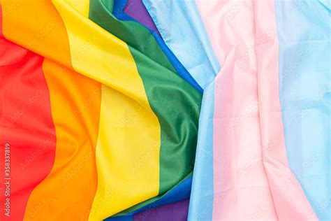 Transgender And Gay Rainbow Flags Fabric LGBT And Transgender Pride Flag As Background Stock